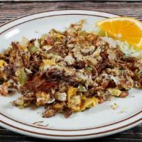 Machaca · Shredded beef mixed with. scrambled eggs, pico de gallo,. bell pepper and onion.  Served wit...