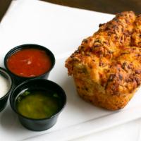 Monkey Bread · Pull-apart house-made bread with cheddar cheese & garlic. Served with your choice of marinar...