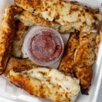 Cheesy Garlic Bread Stick · We spread our creamy garlic sauce on our homemade dough with a sprinkling of our Italian but...