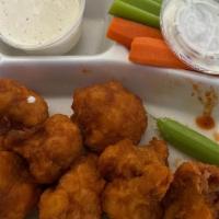 Buffalo Cauliflower · Cauliflower tossed in buffalo sauce.