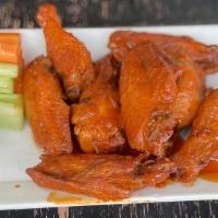 (8) Buffalo Wings · Your choice of sauce, original, hot or BBQ sauce.