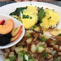 Veggie Benedict · Crispy english muffin, mushroom, spinach, whole grilled onion, and topped with diced green o...
