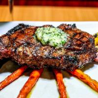 12 Oz. Rib Eye · duck fat fingerlings, candied carrots, compound butter (gf)