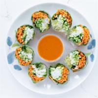 Spring Roll · rice noodles, carrots, cucumbers, sprouts, neatly wrapped in a thin, asian rice paper, cut i...