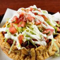 Al Pastor  Sope · Al Pastor, Beans, Lettuce, Salsa Fresca, Sour Cream and, Cotija Cheese