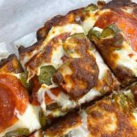 Pepperoni Pizza · Full personal pizza cut into four pieces topped with house-made sauce and a mountain of mozz...