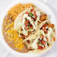 #5- 2 Fish Tacos Plate · Two fish tacos (cod fish) with pico de gallo, cabbage, and tartar sauce on a plate with rice...