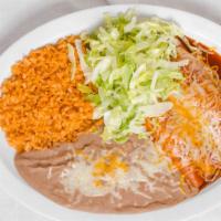 Chicken Enchiladas · Shredded chicken, enchilada sauce, cheese and lettuce.