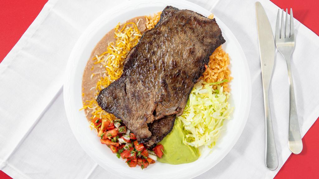 Carne Asada Plate · Grilled steak With rice and beans, guacamole, pico de gallo, lettuce and tortilla.