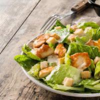Caesar Salad · Romaine lettuce tossed with homemade Caesar dressing, herb croutons and shaved Parmesan.