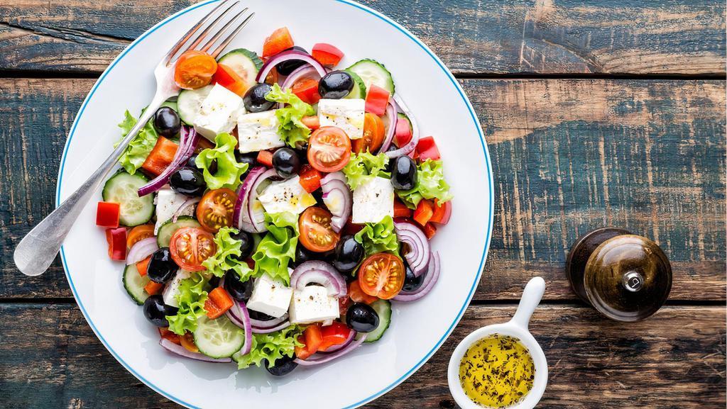 Greek Salad · Tomato, romaine lettuce, cucumber, feta cheese, Kalamata olives and red onion and balsamic vinaigrette dressing.