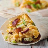 Morning Wrap · Eggs, melty cheddar cheese, bacon, tomato, avocado and roasted potatoes served with house ma...