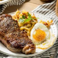 Steak And Eggs · Rib-eye steak, 2 eggs any style, served with roasted potatoes, hash browns or house made chi...