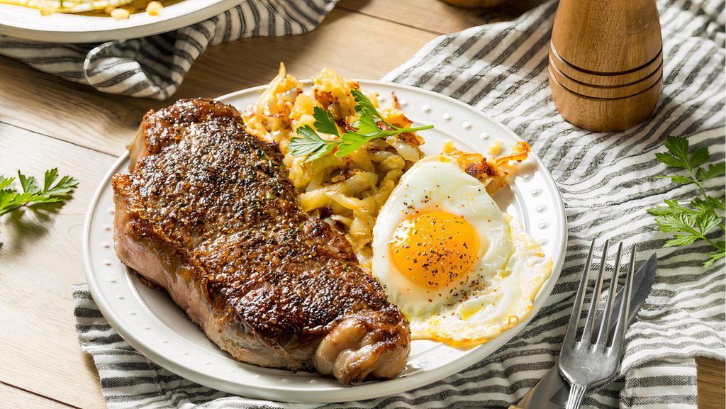 Steak And Eggs · Rib-eye steak, 2 eggs any style, served with roasted potatoes, hash browns or house made chips.