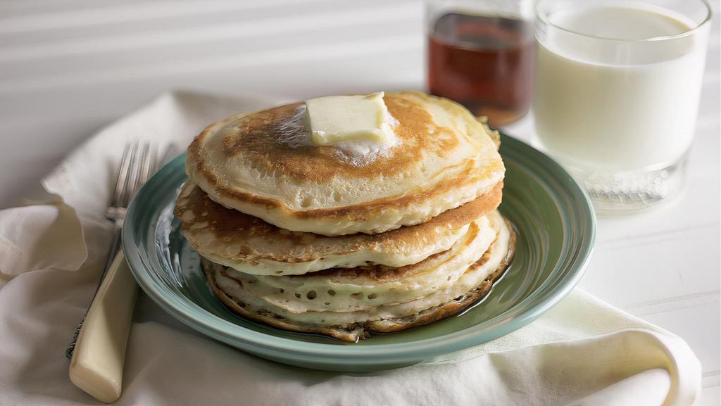 Buttermilk Pancakes · 3 fluffy pancakes served with syrup and butter.