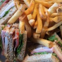 Club Sandwich · Ham, turkey, bacon, lettuce, and tomato on toasted wheat bread with mayo.