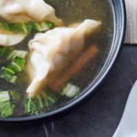 Dumpling Soup · Thai classic clear soup with chicken/veggies dumplings, shrimp, chicken and napa cabbage in ...