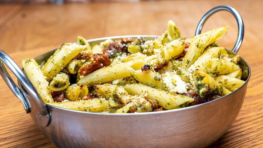 Chicken Pesto Penne · Olive oil pesto sauce, chicken, feta cheese and roasted tomatoes