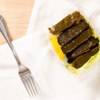 Stuffed Grape Leaves (Sarma) · Grape leaves stuffed with rice, tomatoes, onions, parsley and lemon juice.