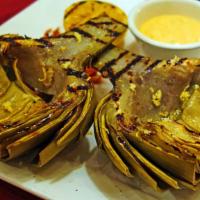 Grilled Artichoke · Gluten free. Split steamed artichoke grilled and served with a spicy calabrian aioli dipping...