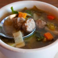 Italian Wedding Soup · Traditional Italian soup with mini meatballs, escarole, and brown rice. Served with fresh ba...