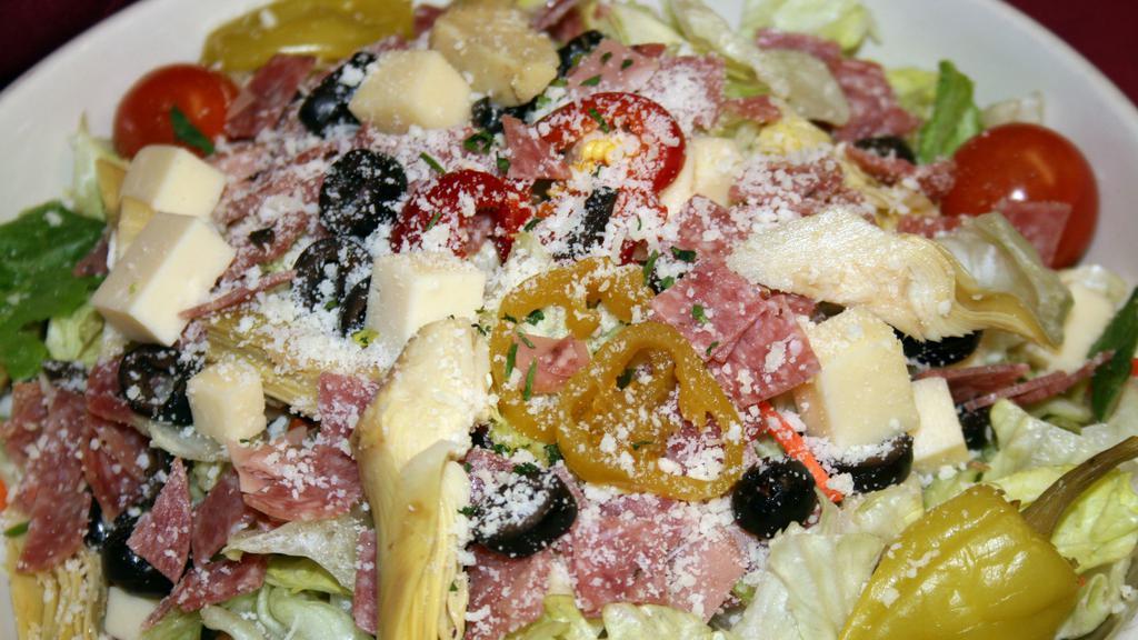 Antipasto Salad · Assorted mixed greens, cold cuts, olives, cannellini beans, artichoke hearts, tomato, red onion, vinegar peppers, asiago cheese, and Italian dressing.