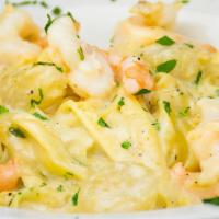 Seafood Alfredo · Large shrimp and fresh sea scallops, tossed with fettuccine pasta and housemade alfredo sauc...