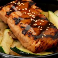 Salmon Teriyaki Bowl · Grilled salmon served over rice with sauteed zucchini, mushrooms, and onions, topped with te...