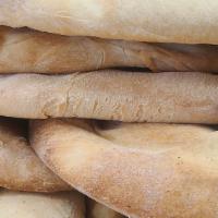 Whole Pita Bread · Our signature pita bread baked in house daily.