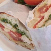 Tuscan Chicken Panini · Grilled chicken, tomatoes, roasted red bell peppers, mozzarella, pesto.