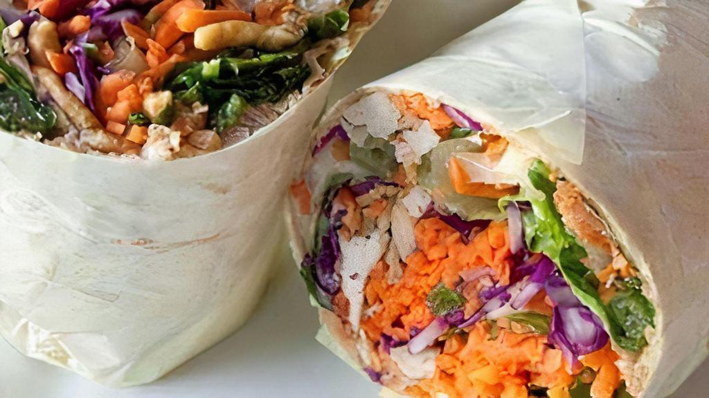 Chinese Chicken Wrap · Romaine, iceberg, cabbage, carrots, roasted almonds, Chinese dressing.