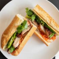 Chicken Banh Mi · Vietnamese BBQ chicken on baguette, housemade mayo, pickled carrots, jalapenos, cilantro, so...