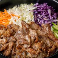Grilled Pork Bowl · Grilled lemongrass pork, jasmine rice, cabbage slaw, cucumbers, pickled carrots, green aioli.