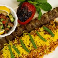 Lobia Polo With Salad Shirazi Salad · Chopped green beans, diced beef cooked in tomato sauce and served with one skewer of ground ...