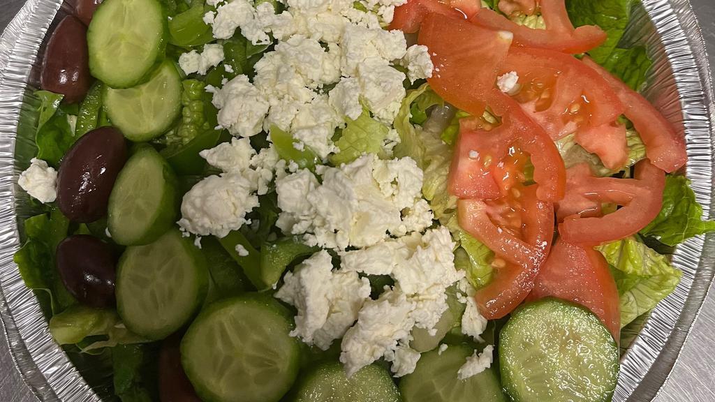Greek Salad · Crisp Romaine lettuce, feta cheese, Roma tomato, cucumbers, Kalamata olives, red onions, green peppers, served with Balsamic Vinaigrette dressing.