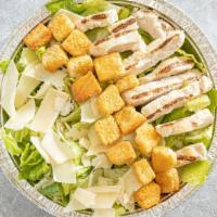Caesar Salad · Crisp Romaine lettuce, homemade croutons, Parmesan cheese, served with Caesar dressing. Add ...