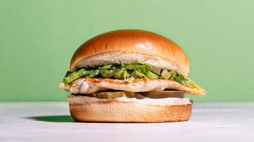 The Signature Grilled · Our signature juicy grilled chicken breast with pickles, mayo, shredded lettuce in between a toasted brioche bun.