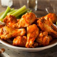 Buffalo Chicken Wings · Fresh buffalo wings, marinated in housemade buffalo sauce served with celery, carrots, and r...