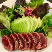 Healthy Herbs Seared Tuna Steak Salad · Herbs, special spices and black pepper. Served with citrus ponzu and flavorful tangy dressing.
