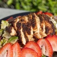 Summer Salad · Mixed greens, strawberries, candied walnuts, feta cheese, blackened chicken, and balsamic dr...