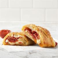 Pepperoni Stromboli · Pepperoni, Mozzarella and Romano cheese rolled in-hand-stretched dough and baked to perfecti...