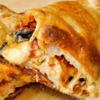 New York Style Calzone · Home-made dough stuffed with ricotta, mozzarella and Parmesan cheese, then baked and served ...