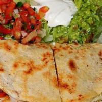 Olga'S Quesadilla · Flour tortilla with melted cheese avocado, bell peppers, and your choice of meat.