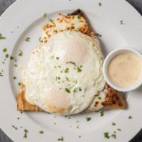 Crepe Madame Breakfast · Jambon De Paris, melted emmental and mozzarella cheeses, topped with two eggs of any style s...