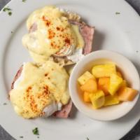 Egg Benedict Breakfast · Two poached egg over English muffin with ham, topped with hollandaise sauce.