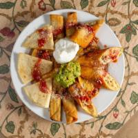 Fiesta Platter  · Beef taquitos, nachos, quesadillas, chimichangas, guacamole, and sour cream.