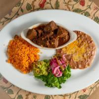 Chile Colorado · Chile colorado tender beef, traditional chile sauce served with beans and rice.