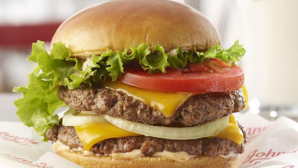 Rocket Double · Double burger blastoff! Two 100% fresh, never frozen certified angus beef patties are grilled to perfection and topped with cheddar cheese, lettuce, tomato, sliced onion and our homemade Special Sauce.