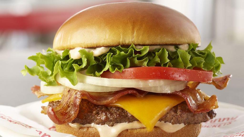 Bacon Cheddar · Pig out on this burger featuring crispy bacon and cheddar cheese atop a 100% fresh, never frozen certified angus beef patty, grilled to perfection. Topped with lettuce, tomato, sliced onion and our homemade Special Sauce.