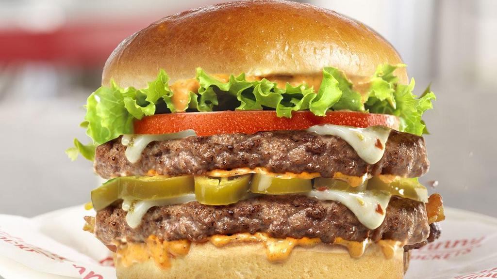 Spicy Houston Double · Doubly smokin’ hot! This burger features two 100% fresh, never frozen certified angus beef patties, grilled to perfection and topped with jalapenos, pepperjack cheese, lettuce, tomato and our homemade Smokin Chipotle Ranch.